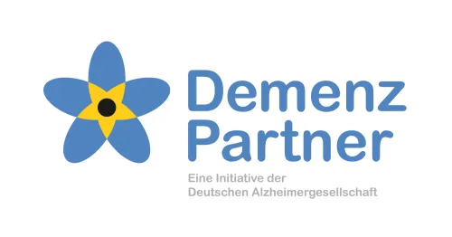 Logo von Demenzpartner Blaue Blume mit gelber Blüte